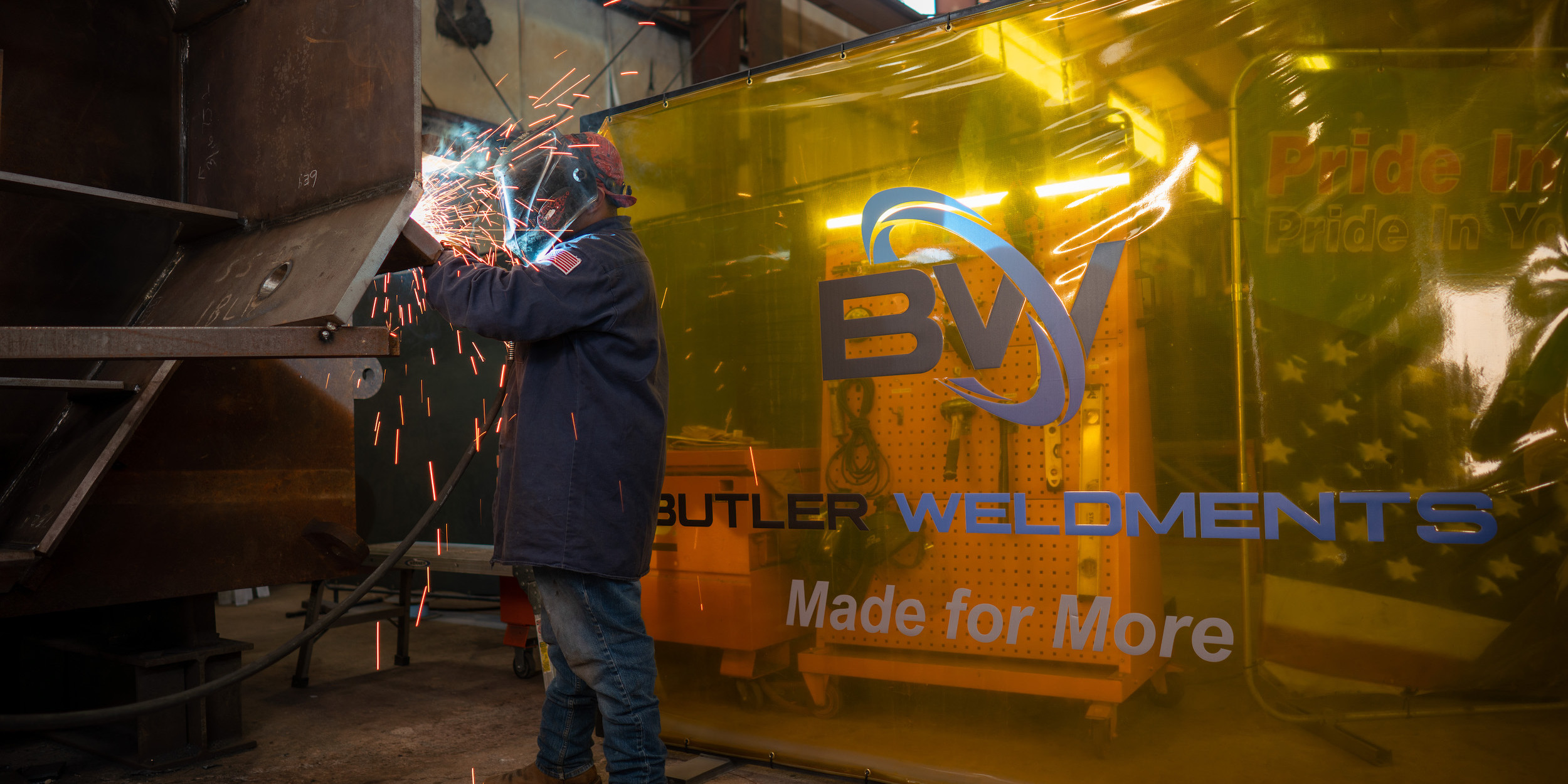 Butler Weldment Employee welding a piece of equipment