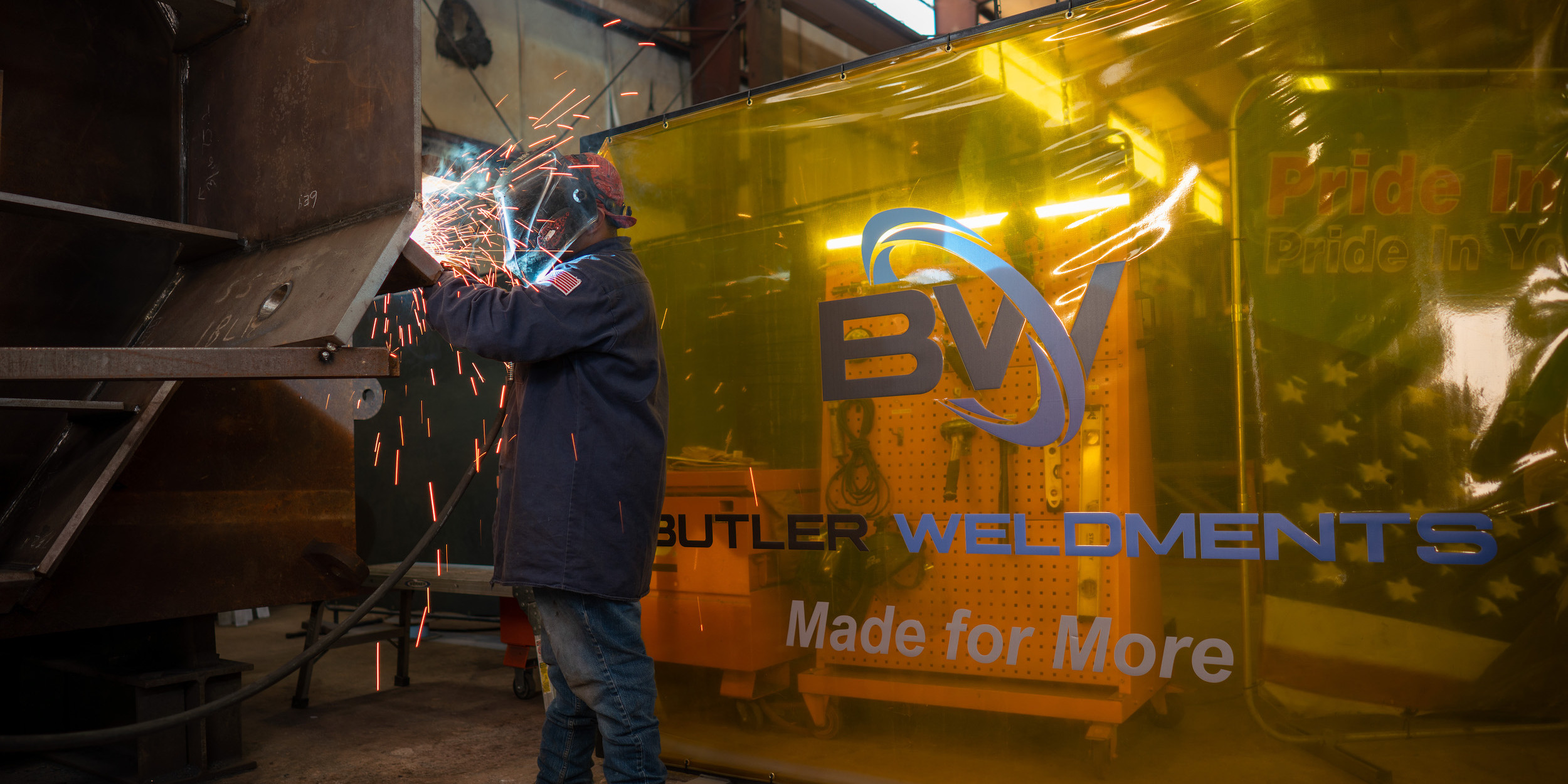Bulter employee welding a piece of equipment